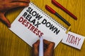 Writing note showing Slow Down Relax Destress. Business photo showcasing calming bring happiness and put you in good mood Man hold