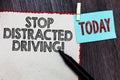 Writing note showing Stop Distracted Driving. Business photo showcasing asking to be careful behind wheel drive slowly White page