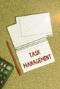 Writing note showing Task Management. Business photo showcasing the process of managing a task through its life cycle Desk