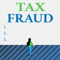 Writing note showing Tax Fraud. Business photo showcasing entails cheating on a tax return in an attempt to avoid paying