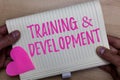 Writing note showing TrainingandDevelopment. Business photo showcasing Organize Additional Learning expedite Skills Man