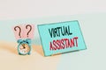 Writing note showing Virtual Assistant. Business photo showcasing demonstrating who provides various services to Royalty Free Stock Photo