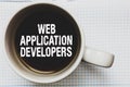 Writing note showing Web Application Developers. Business photo showcasing Internet programming experts Technology software Coffee
