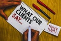 Writing note showing What Our Clients Say.... Business photo showcasing your customer feedback using poll or written paper Man hol Royalty Free Stock Photo