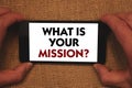 Writing note showing What Is Your Mission Question. Business photo showcasing Positive goal focusing on achieving success Man hol