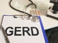 Writing note shows the text GERD gastroesophageal reflux disease Royalty Free Stock Photo