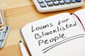 Writing note shows the text loans for blacklisted people