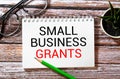 Writing note shows the text VA Small Business Grants