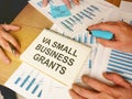 Writing note shows the text VA Small Business Grants