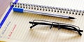 The writing in Notepad. Great day without a bad mood. A detailed notebook and glasses. For work Royalty Free Stock Photo