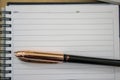 A writing pad and a pen Royalty Free Stock Photo