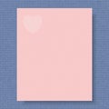 Writing paper on the knitted background both in color of the year 2016 rose quartz and serenity with white heart