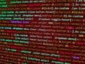Writing program code on computer. Developer working on software codes in office. Computer program preview. Programmer working on Royalty Free Stock Photo