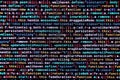 Writing programming code on laptop. Digital binary data on computer screen