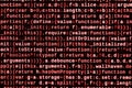 Writing programming code on laptop. Digital binary data on computer screen
