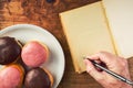Writing recipe for homemade delicious doughnuts with sweet topping Royalty Free Stock Photo