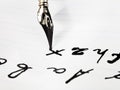 Writing of set of letters by black ink nib Royalty Free Stock Photo