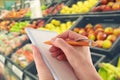 Writing Shopping List by Supermarket Fruit Royalty Free Stock Photo