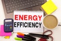 Writing showing Energy Efficiency made in the office with surroundings laptop marker pen. Business concept for Building Technology Royalty Free Stock Photo