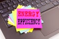 Writing showing Energy Efficiency made in the office with surroundings laptop marker pen. Business concept for Building Technology Royalty Free Stock Photo