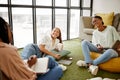 Writing, studying and collaboration student friends in university lounge for a group project, teamwork and planning Royalty Free Stock Photo