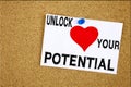 A writing text showing concept of Unlock Your Potential made on sticky note handwritten letters words for Self-Development Improve Royalty Free Stock Photo