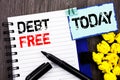 Writing text showing Debt Free. Business photo showcasing Credit Money Financial Sign Freedom From Loan Mortage written on notebo Royalty Free Stock Photo