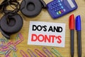 Writing text showing Do s And Do Not Donts. Business concept for Guide Allowed written on sticky note paper on the wooden backgrou
