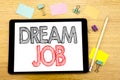 Writing text showing Dream Job. Business concept for Dreaming About Career Written on tablet laptop, wooden background with sticky Royalty Free Stock Photo