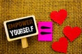Writing text showing Empower Yourself. Concept meaning Positive Motivation Advice For Personal Development written on blackboard Royalty Free Stock Photo