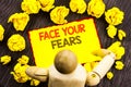 Writing text showing Face Your Fears. Business photo showcasing Challenge Fear Fourage Confidence Brave Bravery written on Sticky