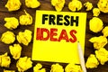 Writing text showing Fresh Ideas. Business concept for Thinking Inspiration Inspire Creativity Written on sticky note paper, woode