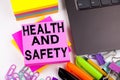 Writing text showing Health and Safety made in the office with surroundings such as laptop, marker, pen. Business concept for Awar