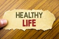 Writing text showing Healthy Life. Business concept for Good Health Food written on note paper on the wooden background with human Royalty Free Stock Photo