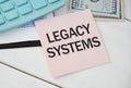 Writing text showing Legacy Systems. Business concept for Upgrade SOA Application written on sticky note paper on wooden