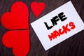 Writing text showing Life Hacks. Concept meaning Solution Hacking Hack Trick To Help Efficiency written on notobook paper note on Royalty Free Stock Photo