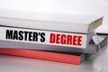 Writing text showing Master s Degree. Business concept for Academic Education written on the book on the white background.