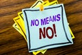 Writing text showing No Means No. Business concept for Stop Anti Slogan written on sticky note paper on the wooden background Royalty Free Stock Photo