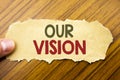 Writing text showing Our Vision. Business concept for Marketing Strategy Vision written on note paper on the wooden background wit Royalty Free Stock Photo
