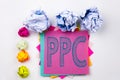 Writing text showing PPC - Pay per Click written on sticky note in office with paper balls. Business concept for Internet SE Royalty Free Stock Photo