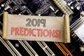 Writing text showing 2019 Predictions. Business concept for Forecast Predictive Written on sticky note, computer main board backgr Royalty Free Stock Photo