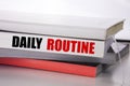 Writing text showing Daily Routine. Business concept for Habitual Lifestyle written on the book on the white background.