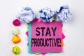 Writing text showing Stay Productive written on sticky note in office with paper balls. Business concept for Concentration E Royalty Free Stock Photo