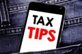 Writing text showing Tax Tips. Business concept for Taxpayer Assistance Refund Reimbursement written mobile cell phone with copy s Royalty Free Stock Photo