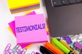 Writing text showing Testimonials made in the office with surroundings such as laptop, marker, pen. Business concept for Consumer