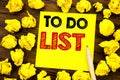 Writing text showing To Do List. Business concept for Plan Lists Remider Written on sticky note paper, wooden background with fold