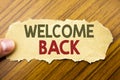 Writing text showing Welcome Back. Business concept for Emotion Greeting written on note paper on the wooden background with human Royalty Free Stock Photo