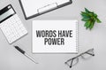 Writing text showing Words Have Power. Calculator,pen,plan,glasses and black folder on grey background Royalty Free Stock Photo