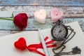 Writing time for love: red rose, journal, pen, and pocket watch Royalty Free Stock Photo