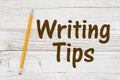 Writing Tips message with a pencil whitewash wood